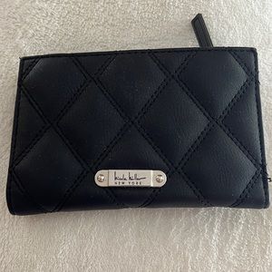 Perfect wallet- space for 16 cards, dollar bills & change & it snaps shut!